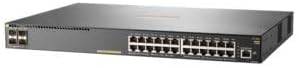 HP JL255A E Aruba 2930F 24G PoE+ switch with 4 SFP+ ports, mounted on a network rack with connected cables.