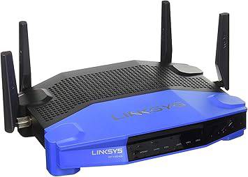 Beaver Computer Linksys WRT1900ACS dual-band smart Wi-Fi gigabit router with four antennas and multiple Ethernet ports on a desk.