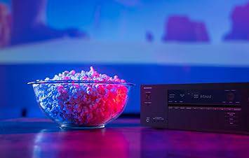 Onkyo TX-SR3100 5.2-channel AV receiver with Dolby Atmos, Dolby Vision, and virtualizer features, shown in a home theater setup.