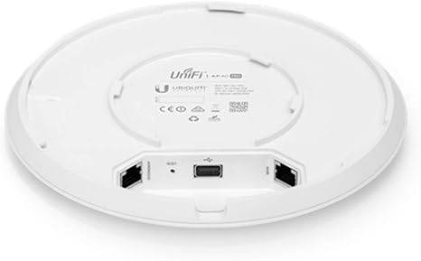 Ubiquiti UAP-AC-PRO Unifi AC Pro wireless access point mounted on a wall for Wi-Fi coverage.