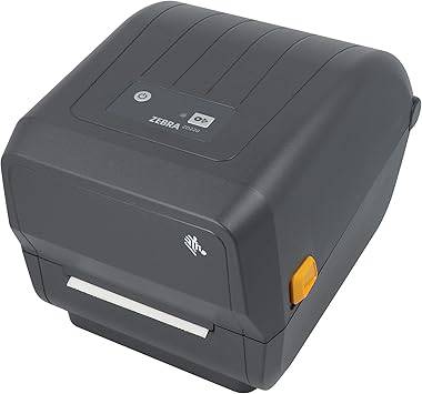 Zebra ZD220d black direct thermal USB barcode label printer on a desk with cables and printed labels visible