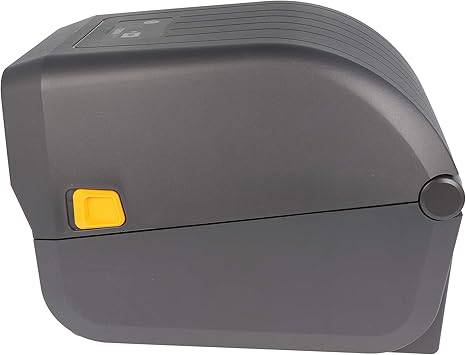 Zebra ZD220d black direct thermal USB barcode label printer on a desk with cables and printed labels visible