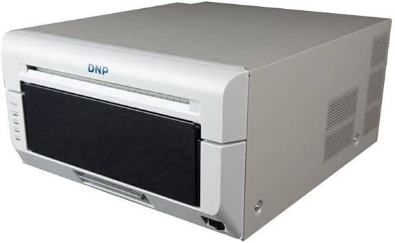 DNP DS820A 8-inch professional dye-sublimation printer printing 8x10 and 8x12 photos, with paper trays and control panel visible.