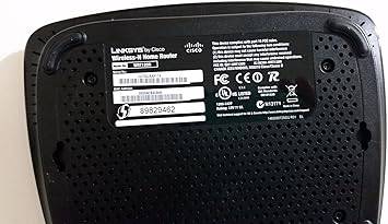 Wireless N home router by Linksys by Cisco, black device with multiple antennas for home Wi-Fi connectivity.