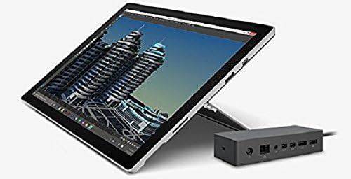 Microsoft Surface Dock connected to Surface Pro 4 and Surface Book, featuring multiple ports and sleek design