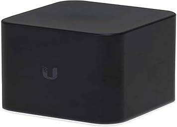 Ubiquiti airMAX ACB-AC Wi-Fi access point mounted on wall, black rectangular device for home wireless network.
