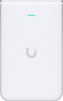 Ubiquiti UniFi UAP-IW-HD-US in-wall high-density access point mounted on wall, black device with vents and Ethernet port visible.