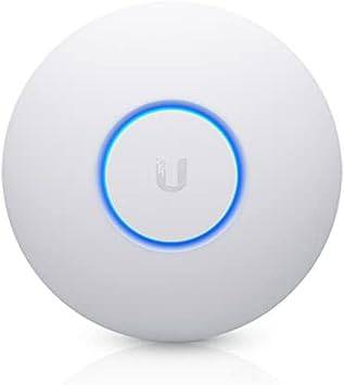 Ubiquiti UniFi UAP-nanoHD-5 wireless access point mounted on wall, compact design, with multiple antennas for high-speed Wi-Fi coverage